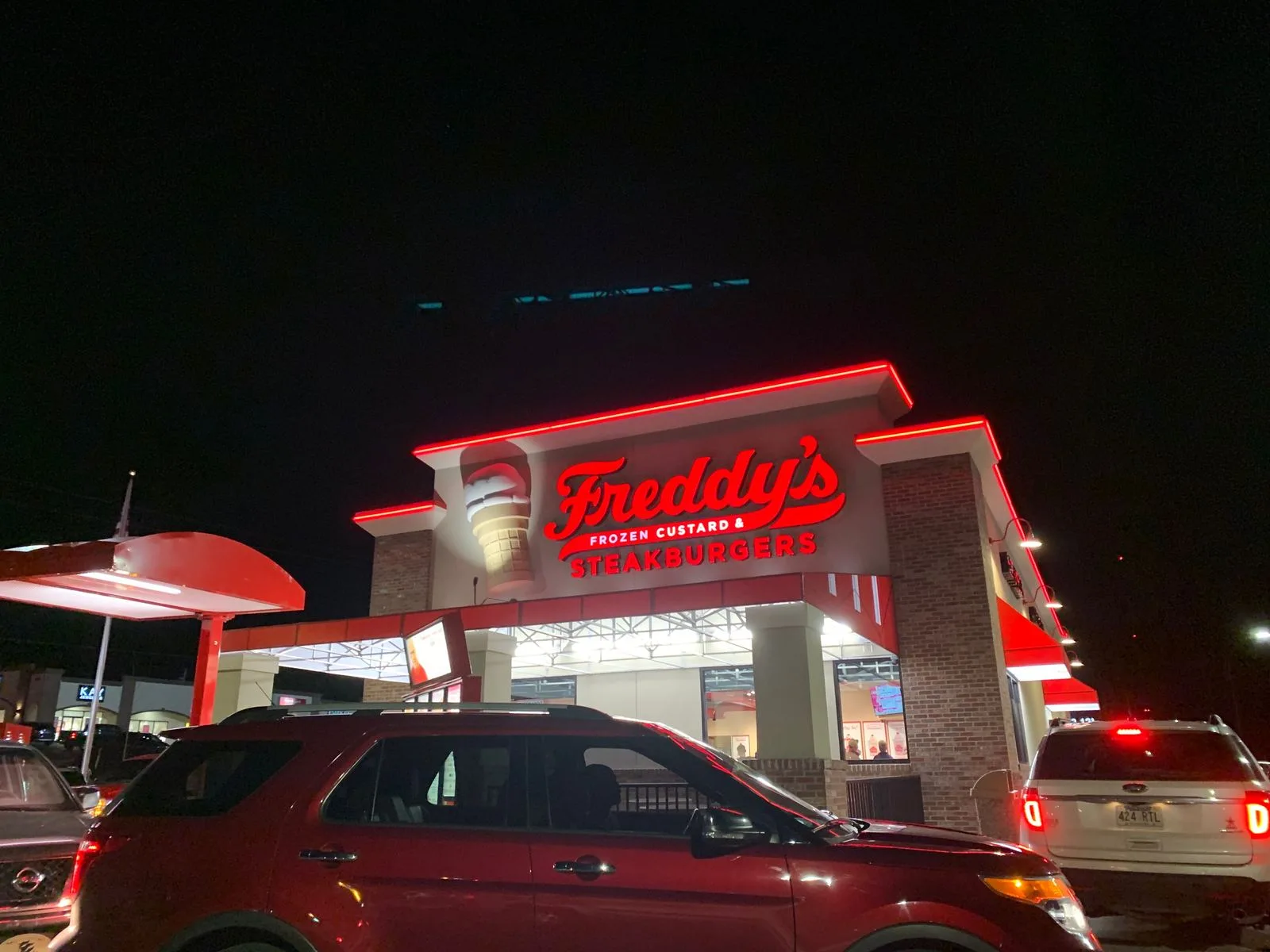Illuminated Freddy&rsquo;s channel letters lit at night, provided and installed by Seiz Sign Company