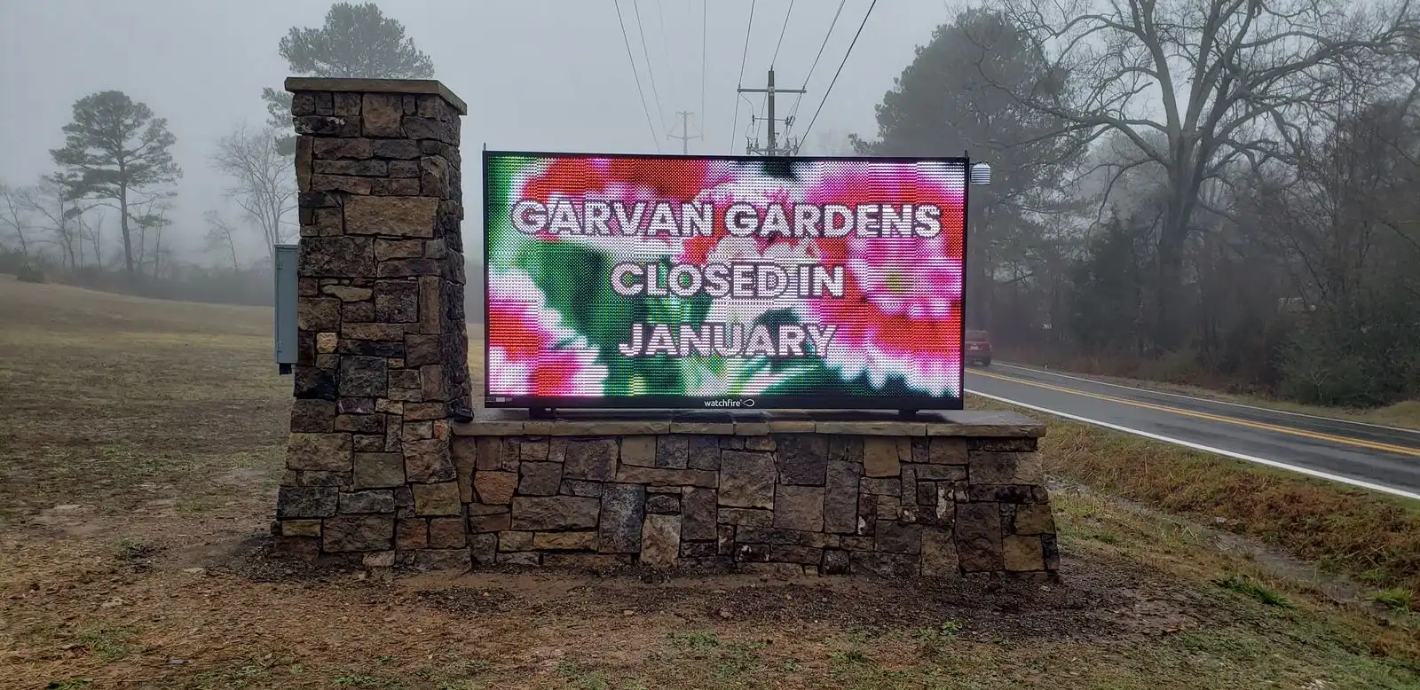 Garvan Woodland Gardens stone monument sign with a UL-listed full-color LED message center, installed by Seiz Sign Company
