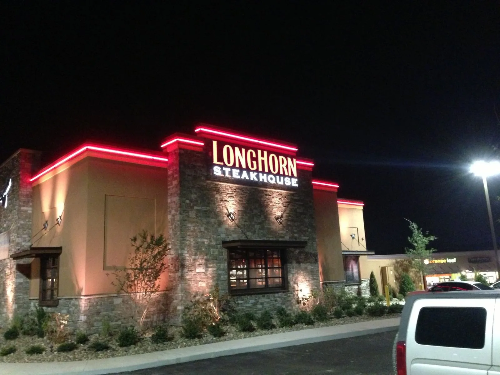 Illuminated channel letters installed on a restaurant storefront