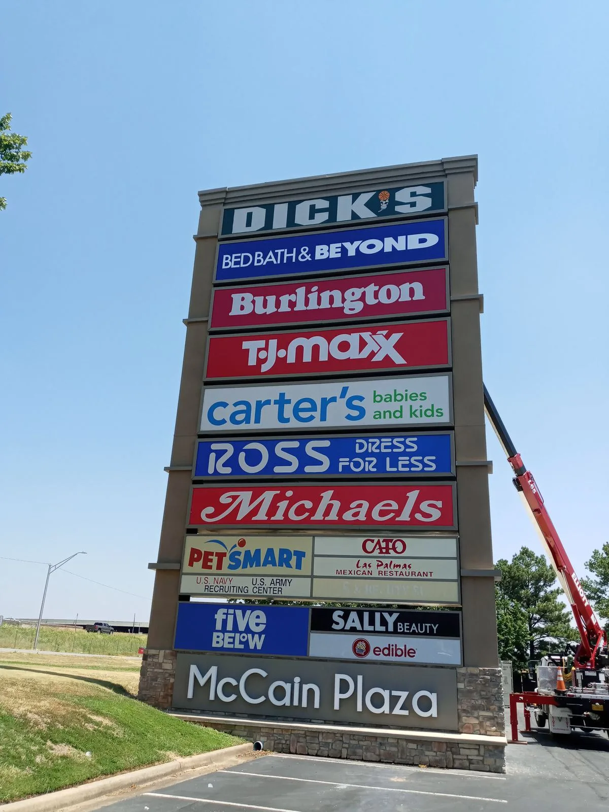 McCain Plaza multi-tenant pylon sign with stacked tenant panels, provided and installed by Seiz Sign Company