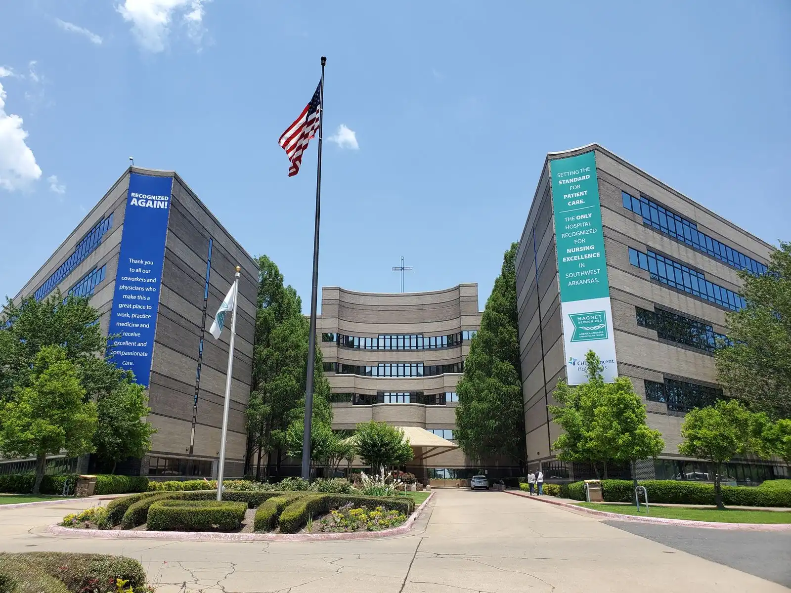 Large printed wall banners on the CHI St. Vincent hospital towers, installed by Seiz Sign Company