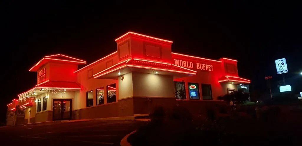 UL-listed LED border lighting outlining the World Buffet building at night, installed by Seiz Sign Company