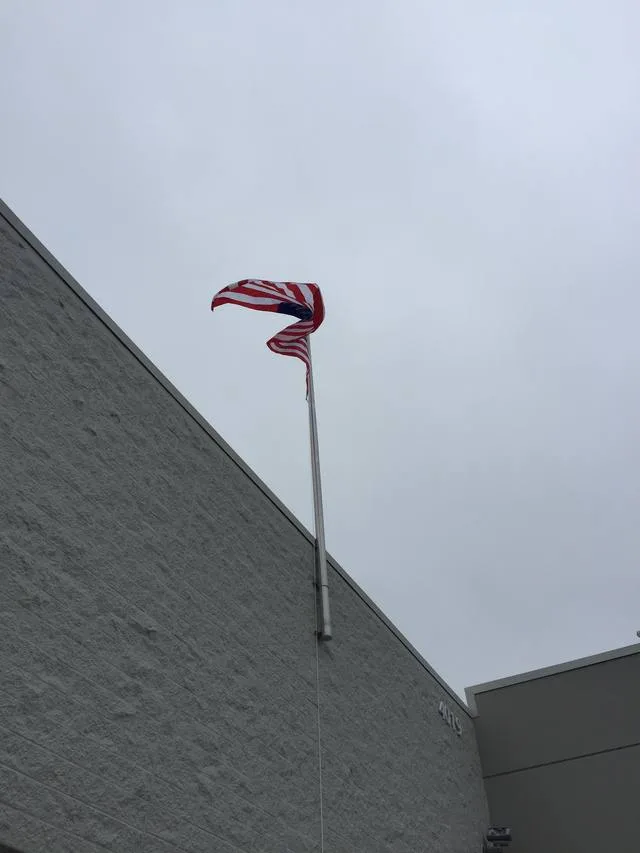 Wall-Mounted Flagpole - Pole & Pylon Signs by Seiz Sign Company