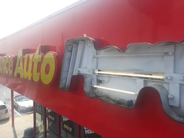 Faces removed from the Advance Auto Parts sign as Seiz Sign Company converts the fluorescent lamps to UL-listed LEDs