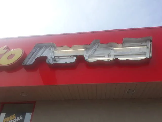 Advance Auto Parts sign letters opened up with the original fluorescent lamps exposed during the LED conversion