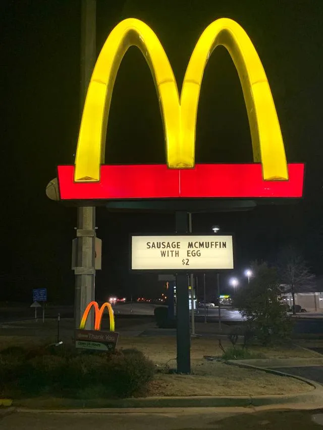 McDonald's arches pylon sign lit at night after its completed UL-listed LED retrofit by Seiz Sign Company
