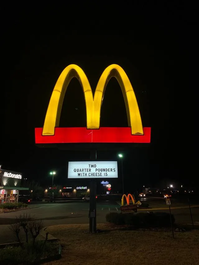 Completed McDonald's arches pylon sign with UL-listed LED illumination, seen from the roadway