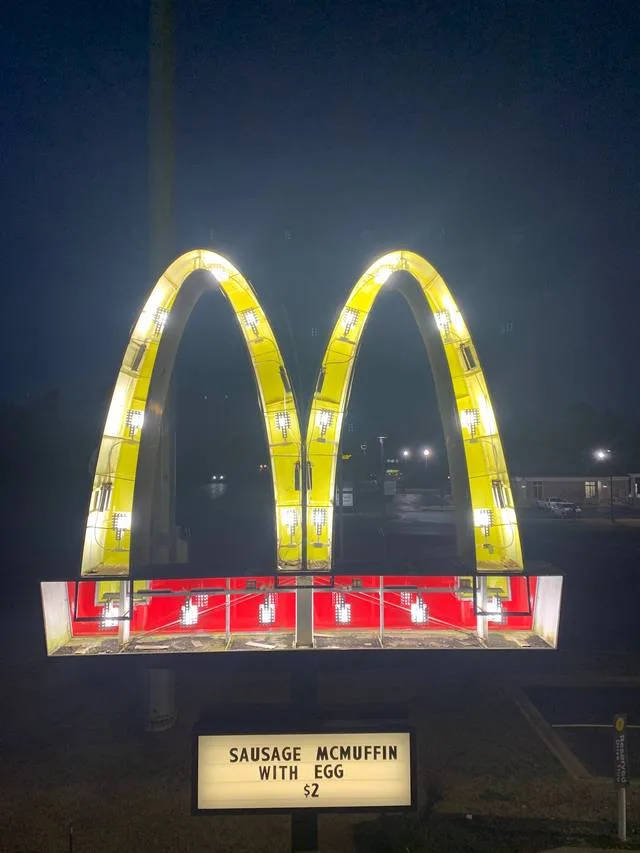 McDonald's arches sign with the faces off and UL-listed LED modules exposed during the retrofit